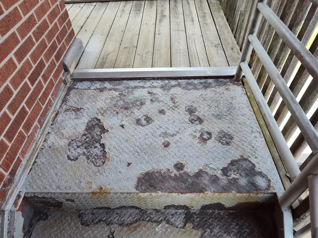 Top landing showing heavy rust damage