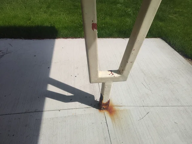 Close-up of severe corrosion at post base plate