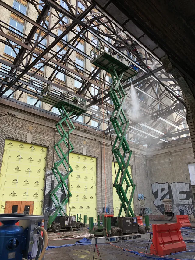 Michigan Central Train Station — scissor lifts and blast mist in the grand hall