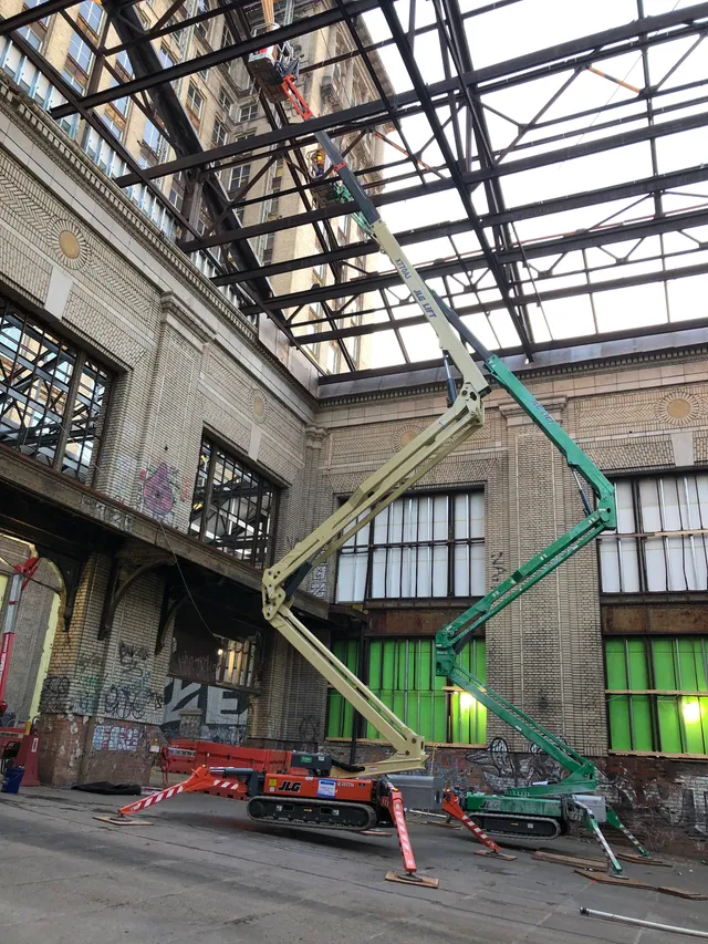 Michigan Central Train Station — boom lift reaching the ornate roof structure