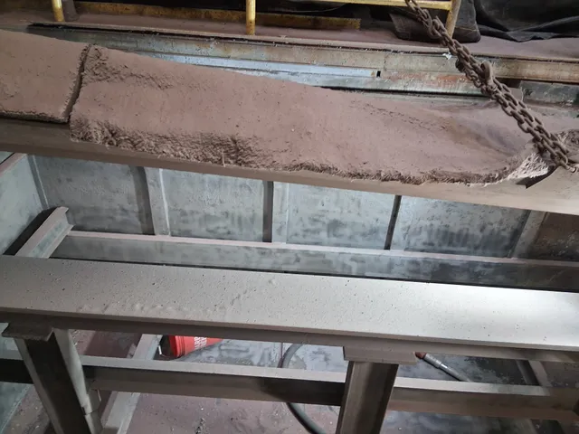 Alloy mold being blasted and cleaned