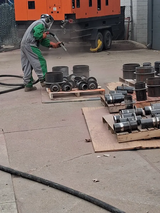 Pipe fittings after mill scale removal — clean bare steel