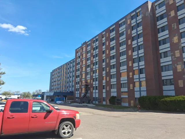 Concord Tower Apartments — building exterior with mobile blast rig