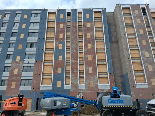 Concord Tower Apartments — boom lifts positioned on the tower facade