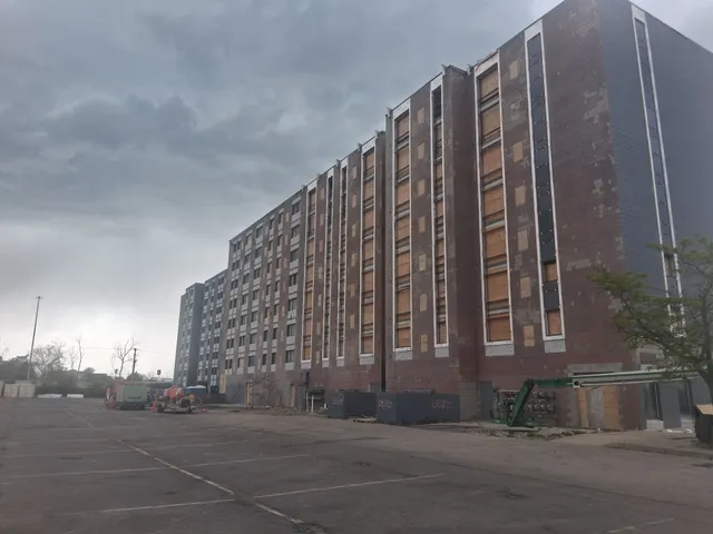Concord Tower Apartments — high-rise facade blast prep, overcast