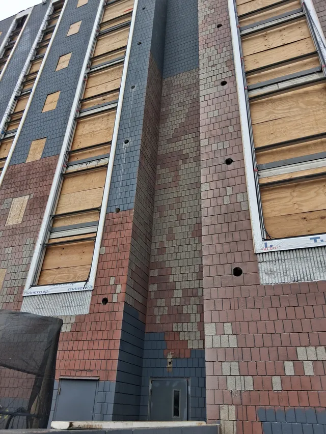 Concord Tower Apartments — facade corner detail during blast prep