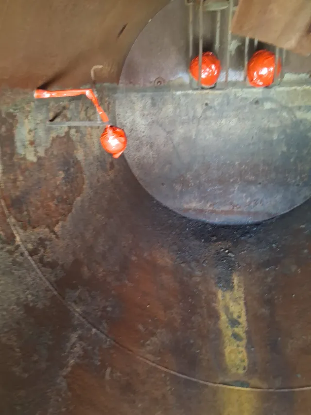 Corroded interior of vacuum truck tank before blasting