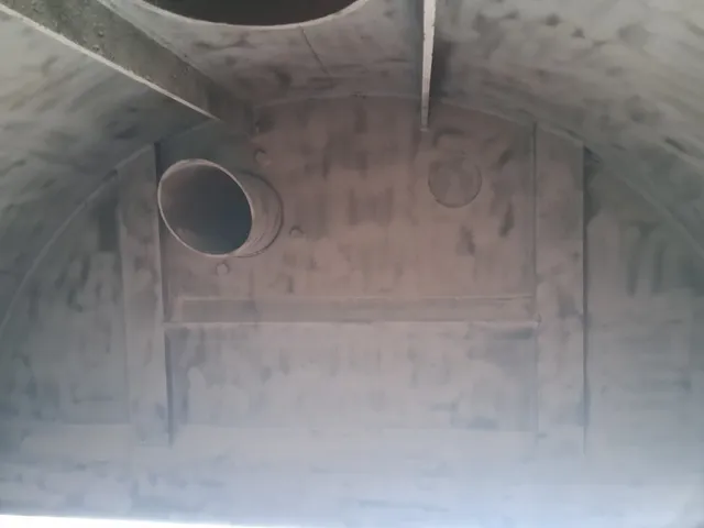 Vacuum truck tank interior after blasting, fittings exposed